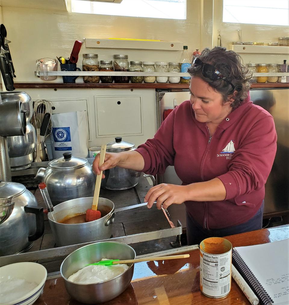 Chef Anna Miller cooking in the galley.