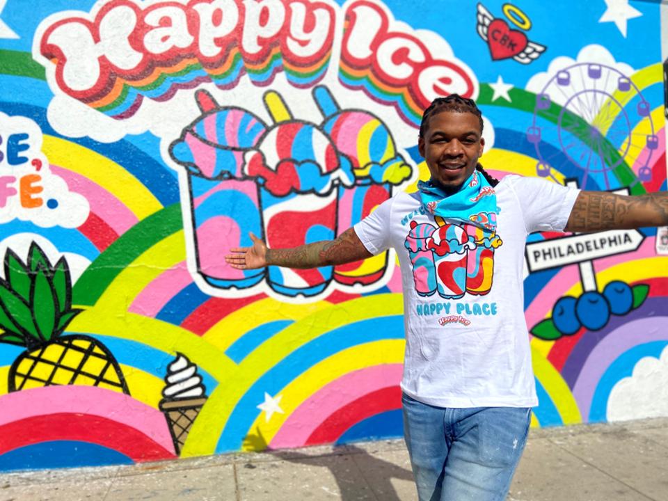 lemeir mitchell in front of a happy ice store wall