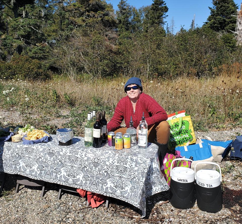 Lara Nixon at her bar on the beach.