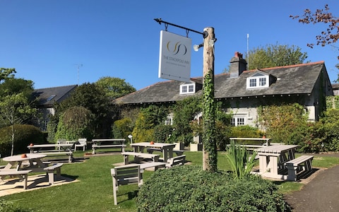 It's tempting to sit in a beer garden, like this one at The Stackpole Inn, knocking back beer and wine to cool down - but try to drink some water, too