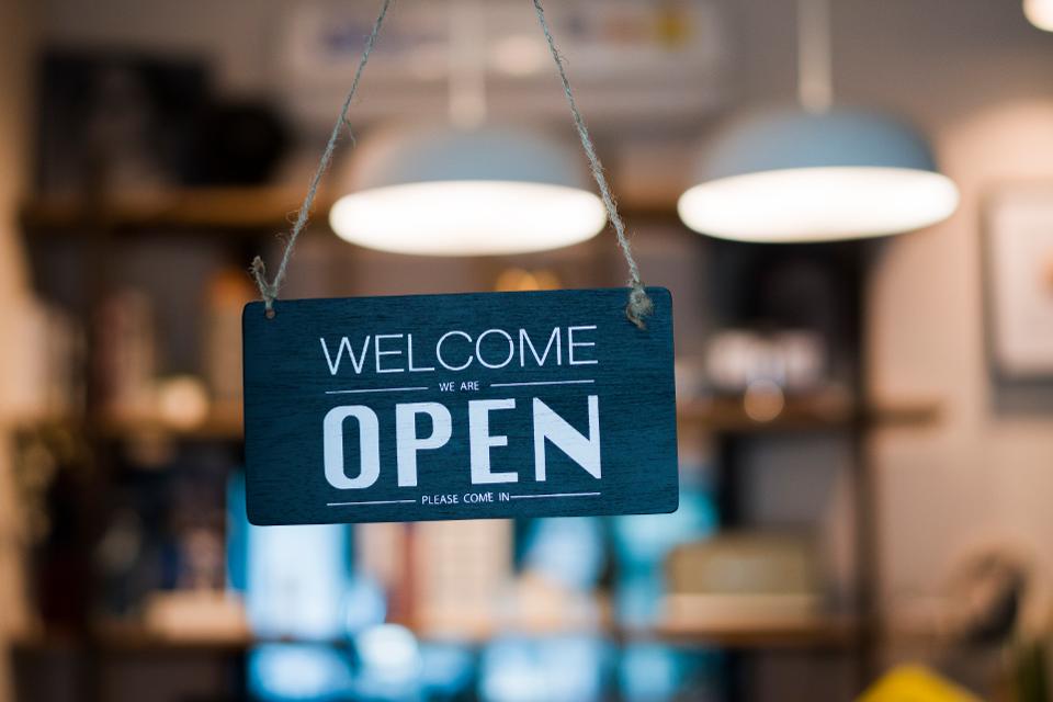 Store open sign hanging on the window