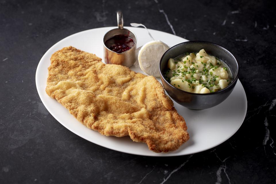 schnitzel on a platter with potatoes